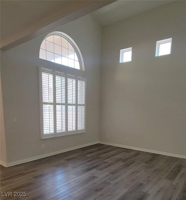 5509 Big Sky Ln, Las Vegas, NV 89149 - unfurnished room with plenty of natural light, dark wood-type flooring, and baseboards
