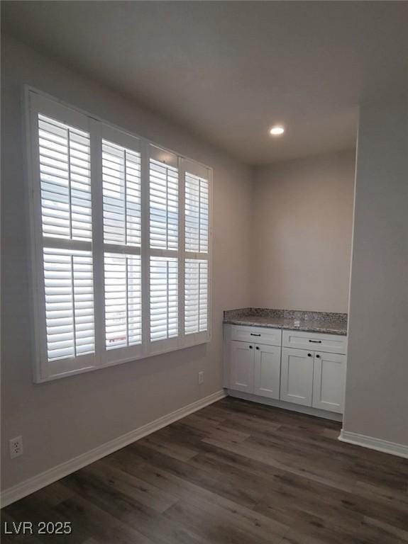 5509 Big Sky Ln, Las Vegas, NV 89149 - unfurnished room featuring dark wood-style floors, baseboards, and recessed lighting