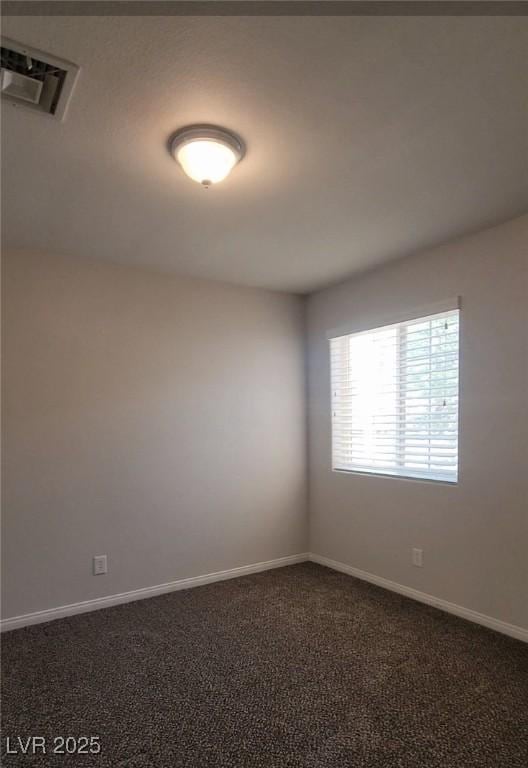 5509 Big Sky Ln, Las Vegas, NV 89149 - empty room featuring dark colored carpet and baseboards