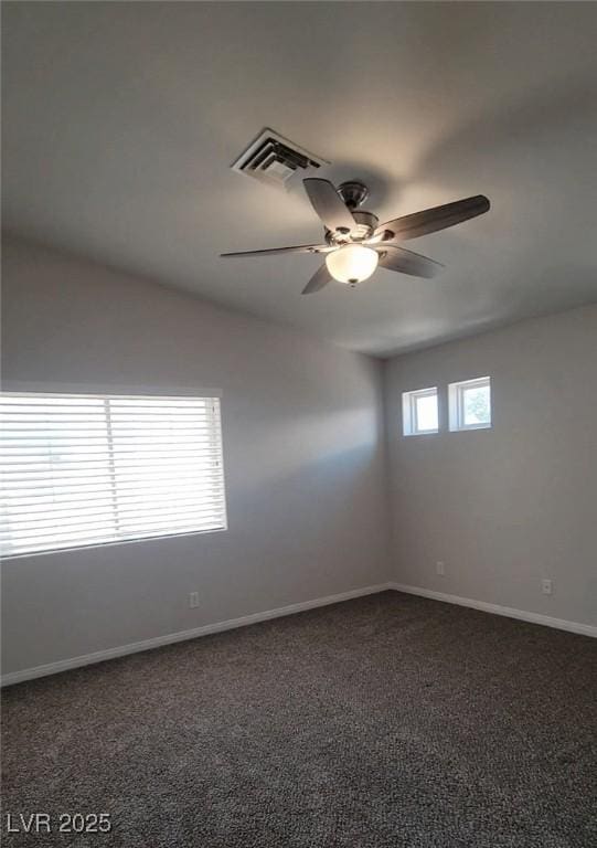 5509 Big Sky Ln, Las Vegas, NV 89149 - unfurnished room featuring a ceiling fan, dark colored carpet, and baseboards