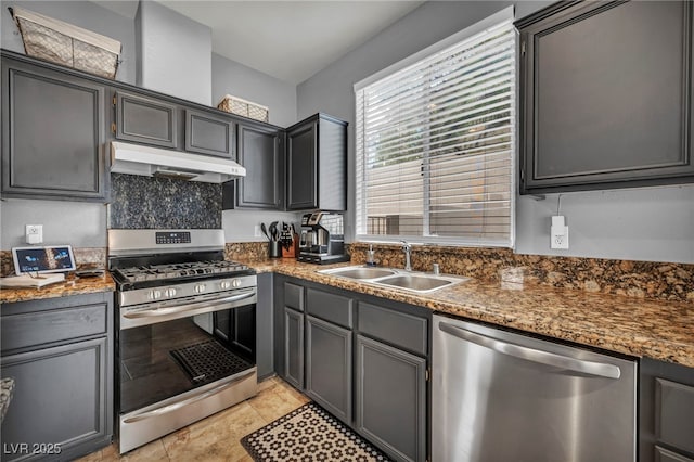 10952 Napa Ridge Dr, Las Vegas, NV 89144 - kitchen featuring appliances with stainless steel finishes, under cabinet range hood, and light tile patterned flooring