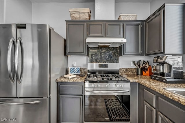 10952 Napa Ridge Dr, Las Vegas, NV 89144 - kitchen with appliances with stainless steel finishes, exhaust hood, light stone countertops, and backsplash