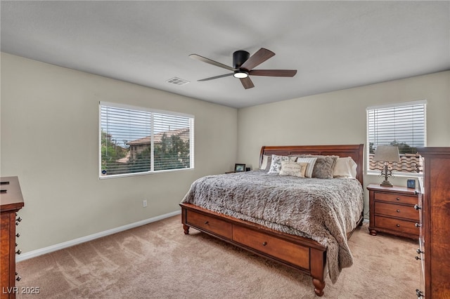 10952 Napa Ridge Dr, Las Vegas, NV 89144 - bedroom with light carpet, multiple windows, and ceiling fan