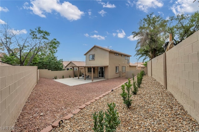 10952 Napa Ridge Dr, Las Vegas, NV 89144 - rear view of house with a patio, stucco siding, and a fenced backyard