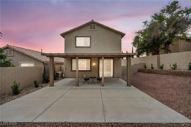 10952 Napa Ridge Dr, Las Vegas, NV 89144 - rear view of house with stucco siding, a fenced backyard, and a patio area