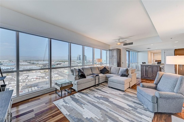 4525 Dean Martin Dr Unit 1208, Las Vegas, NV 89103 - living area featuring ceiling fan and wood finished floors