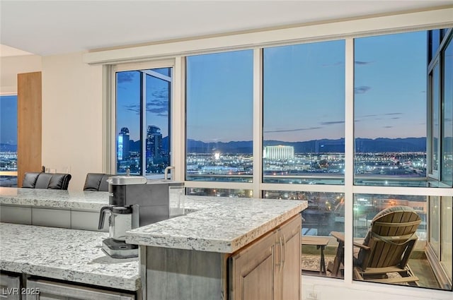 4525 Dean Martin Dr Unit 1208, Las Vegas, NV 89103 - kitchen featuring a city view, plenty of natural light, and a mountain view