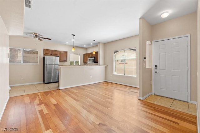 8409 Running Deer Ave Unit 203, Las Vegas, NV 89145 - entrance foyer with light wood finished floors, ceiling fan, and recessed lighting