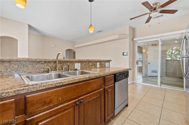 8409 Running Deer Ave Unit 203, Las Vegas, NV 89145 - kitchen with stainless steel dishwasher, light tile patterned floors, decorative light fixtures, and light countertops