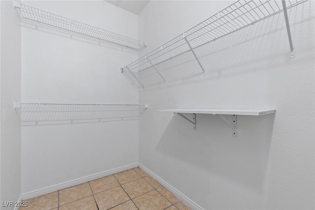 8409 Running Deer Ave Unit 203, Las Vegas, NV 89145 - walk in closet with light tile patterned flooring