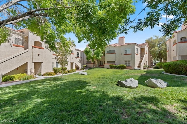 8409 Running Deer Ave Unit 203, Las Vegas, NV 89145 - view of property's community featuring stairway and a lawn