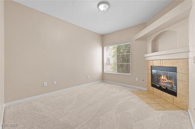 8409 Running Deer Ave Unit 203, Las Vegas, NV 89145 - unfurnished living room featuring carpet flooring and a fireplace