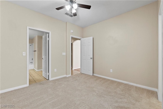 8409 Running Deer Ave Unit 203, Las Vegas, NV 89145 - unfurnished bedroom featuring light carpet and ceiling fan