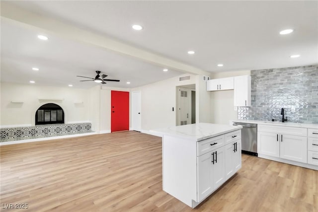 3212 Hickey Ave, North Las Vegas, NV 89030 - kitchen with dishwasher, a sink, light wood-style floors, white cabinetry, and recessed lighting