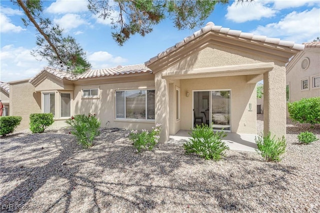 2323 Barbers Point Pl, Las Vegas, NV 89134 - back of house with a tiled roof and stucco siding