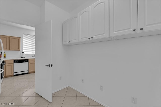 2323 Barbers Point Pl, Las Vegas, NV 89134 - laundry area with light tile patterned floors and baseboards