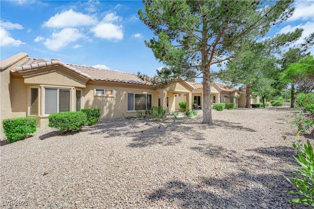 2323 Barbers Point Pl, Las Vegas, NV 89134 - rear view of house featuring a tiled roof and stucco siding
