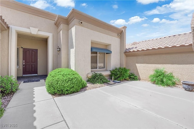 2323 Barbers Point Pl, Las Vegas, NV 89134 - view of exterior entry featuring stucco siding and a patio area