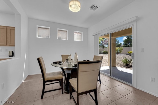 2323 Barbers Point Pl, Las Vegas, NV 89134 - dining room featuring light tile patterned floors, baseboards, and a chandelier
