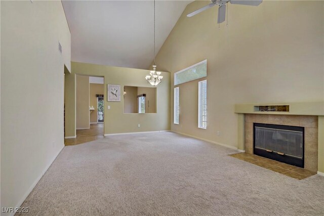 1305 Chaparral Summit Dr, Las Vegas, NV 89117 - unfurnished living room with high vaulted ceiling, carpet, baseboards, a chandelier, and a tile fireplace