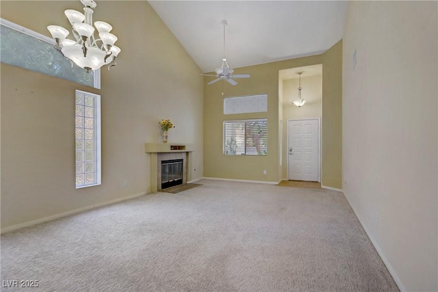 1305 Chaparral Summit Dr, Las Vegas, NV 89117 - unfurnished living room with high vaulted ceiling, light colored carpet, a chandelier, baseboards, and a tiled fireplace
