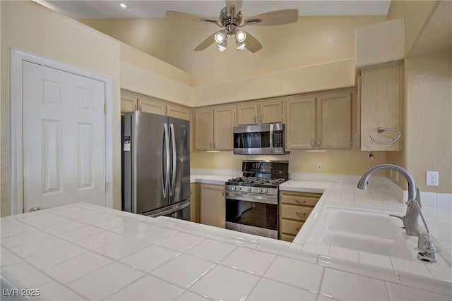 1305 Chaparral Summit Dr, Las Vegas, NV 89117 - kitchen with appliances with stainless steel finishes, tile counters, a sink, ceiling fan, and light brown cabinetry