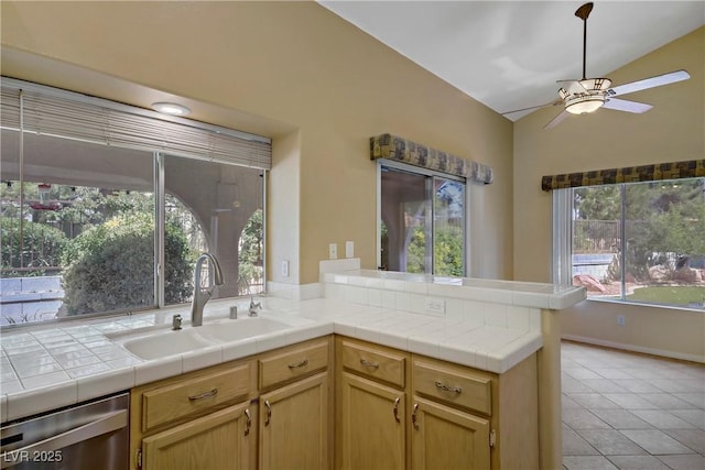 1305 Chaparral Summit Dr, Las Vegas, NV 89117 - kitchen featuring a sink, stainless steel dishwasher, a ceiling fan, vaulted ceiling, and light tile patterned flooring