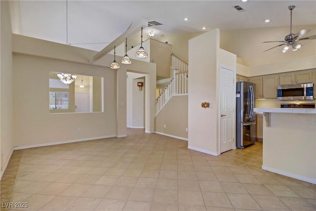 1305 Chaparral Summit Dr, Las Vegas, NV 89117 - kitchen with appliances with stainless steel finishes, light countertops, ceiling fan, light tile patterned floors, and baseboards
