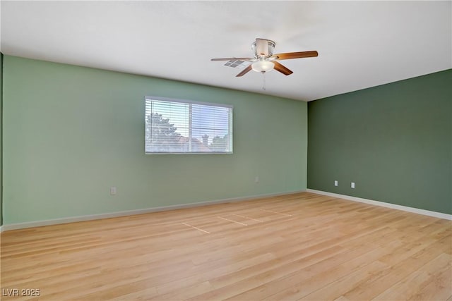 1305 Chaparral Summit Dr, Las Vegas, NV 89117 - empty room with a ceiling fan, light wood-style floors, and baseboards