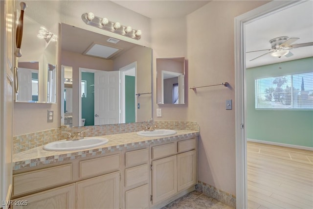 1305 Chaparral Summit Dr, Las Vegas, NV 89117 - bathroom with double vanity, baseboards, a ceiling fan, and toilet