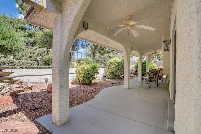 1305 Chaparral Summit Dr, Las Vegas, NV 89117 - fenced backyard with a ceiling fan and a patio