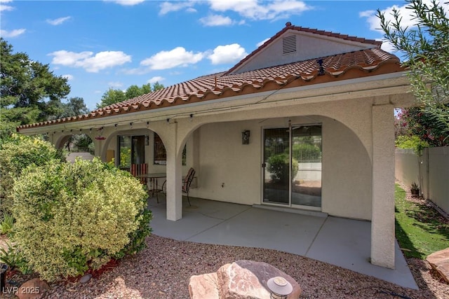 1305 Chaparral Summit Dr, Las Vegas, NV 89117 - rear view of property with stucco siding and a patio