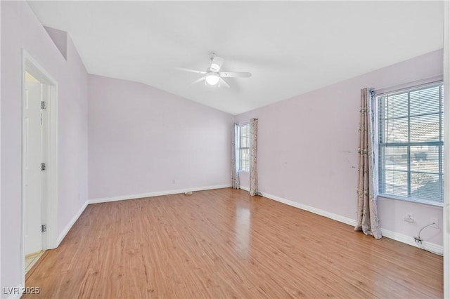 5429 Sweet Shade St, Las Vegas, NV 89130 - spare room with ceiling fan, light wood-style floors, vaulted ceiling, and baseboards