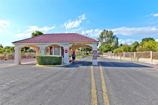 5429 Sweet Shade St, Las Vegas, NV 89130 - view of asphalt road with a gated entry and a gate
