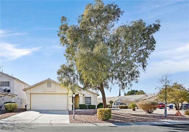 5429 Sweet Shade St, Las Vegas, NV 89130 - view of front facade with an attached garage, driveway, and stucco siding