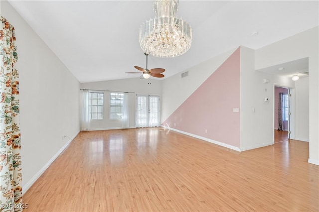 5429 Sweet Shade St, Las Vegas, NV 89130 - unfurnished living room with light wood finished floors, ceiling fan, a chandelier, lofted ceiling, and baseboards