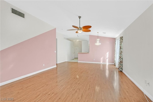5429 Sweet Shade St, Las Vegas, NV 89130 - unfurnished living room featuring vaulted ceiling, a ceiling fan, light wood-style floors, and baseboards