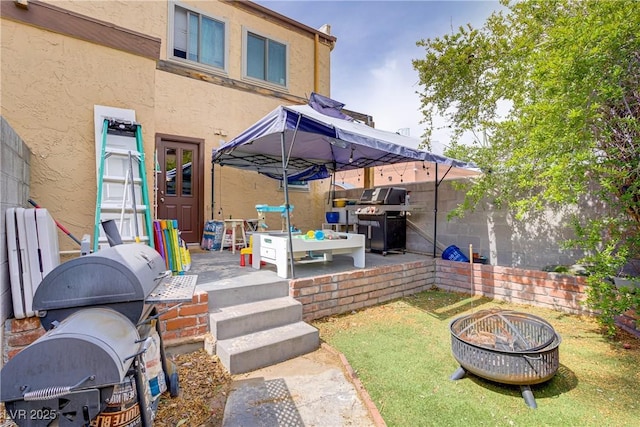 5706 W Lake Mead Blvd, Las Vegas, NV 89108 - fenced backyard with an outdoor fire pit and a gazebo