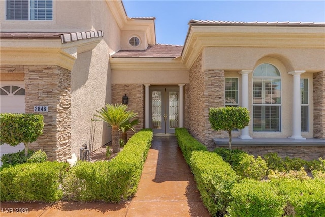 2846 Barrow Downs St, Las Vegas, NV 89135 - property entrance with french doors, stone siding, and stucco siding