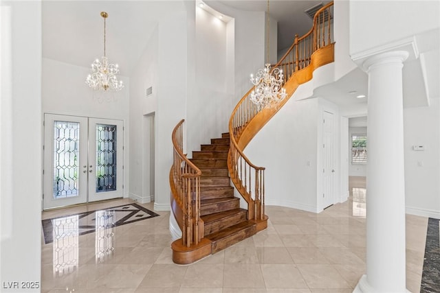 2846 Barrow Downs St, Las Vegas, NV 89135 - foyer entrance featuring a high ceiling, baseboards, stairway, french doors, and a chandelier