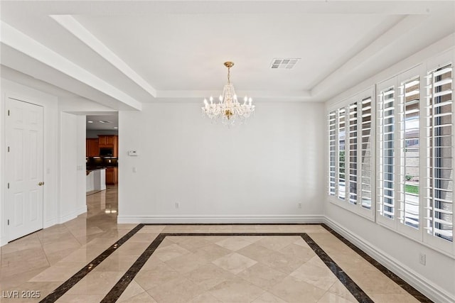 2846 Barrow Downs St, Las Vegas, NV 89135 - empty room with inlaid floor details, a tray ceiling, a chandelier, and baseboards