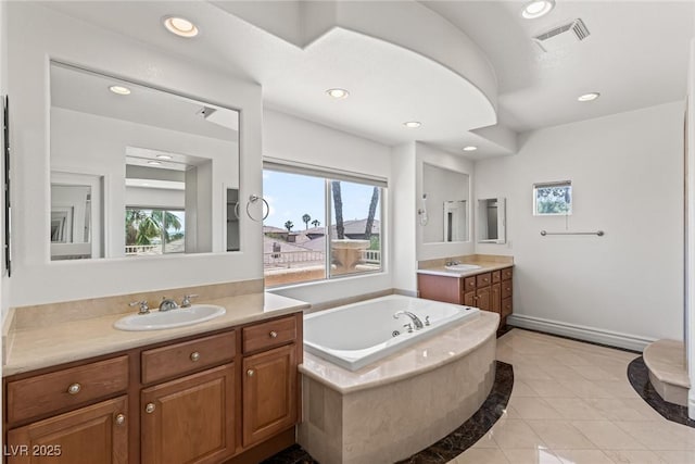 2846 Barrow Downs St, Las Vegas, NV 89135 - full bath with two vanities, recessed lighting, tile patterned floors, a garden tub, and inlaid floor details