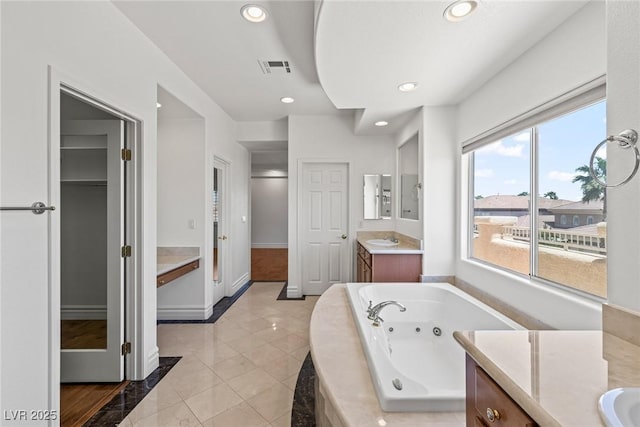 2846 Barrow Downs St, Las Vegas, NV 89135 - full bath with vanity, a tub with jets, recessed lighting, baseboards, and a closet