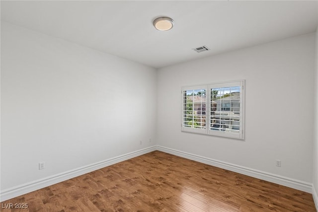 2846 Barrow Downs St, Las Vegas, NV 89135 - unfurnished room with baseboards and wood finished floors