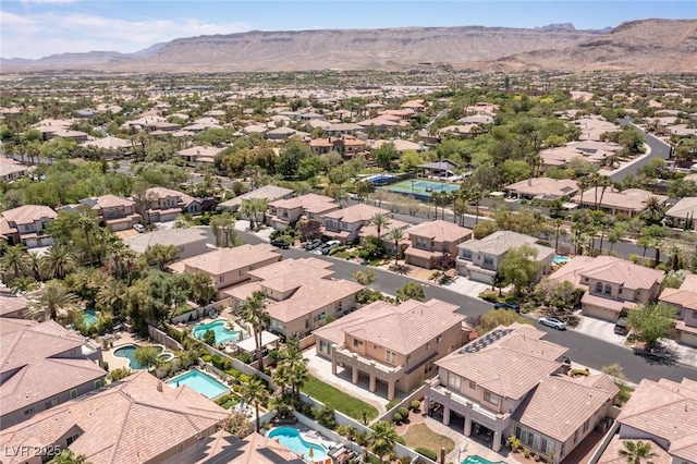 2846 Barrow Downs St, Las Vegas, NV 89135 - aerial perspective of suburban area featuring a pool area and mountains