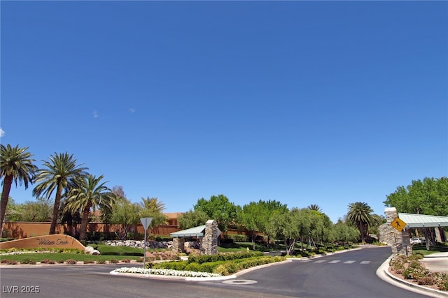 2846 Barrow Downs St, Las Vegas, NV 89135 - view of asphalt road featuring traffic signs and curbs