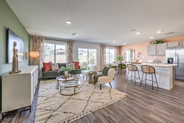 803 Calm Crystal Ct Lot 143, North Las Vegas, NV 89081 - living room with plenty of natural light, wood finished floors, and recessed lighting