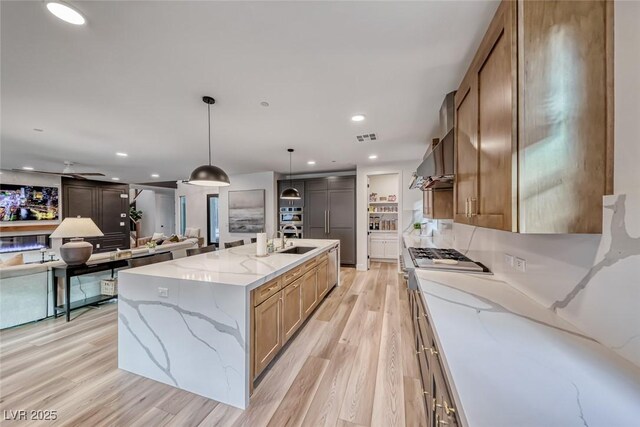 365 Crown Mesa Ave, Las Vegas, NV 89138 - kitchen with a sink, light wood-style floors, wall chimney range hood, recessed lighting, and a large island