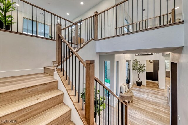 365 Crown Mesa Ave, Las Vegas, NV 89138 - stairs with wood finished floors, a high ceiling, baseboards, and recessed lighting