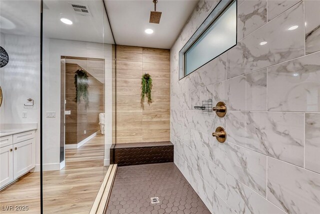 365 Crown Mesa Ave, Las Vegas, NV 89138 - bathroom with a tile shower, vanity, and wood finished floors